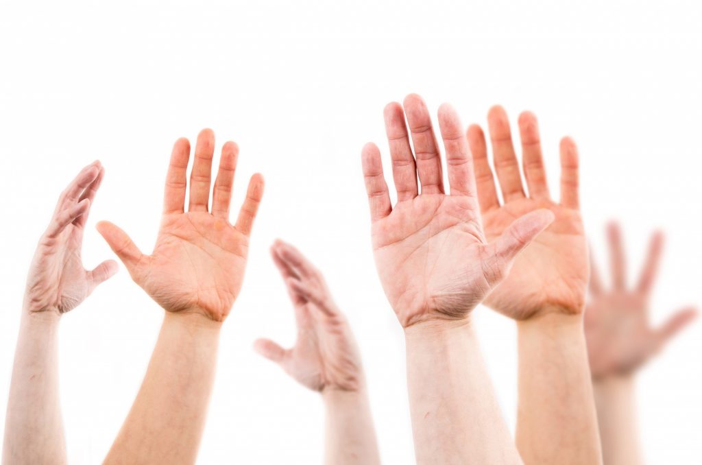 seven hands asking questions